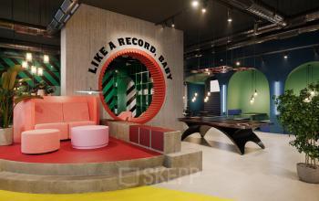 Modern office space rental at Nordbahnstraße 47, 1020 Vienna Leopoldstadt, featuring a vibrant lounge area with eclectic furnishings and a pool table.