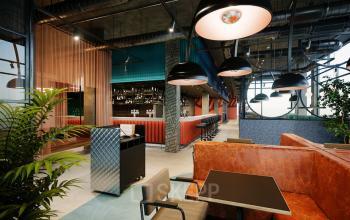 Chic office space rental at Nordbahnstraße 47 in 1020 Vienna (Leopoldstadt) with modern furniture and vibrant decor.