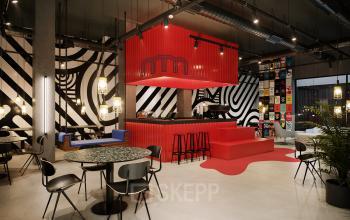 Stylish office space rental at Nordbahnstraße 47, 1020 Vienna featuring a trendy lounge area with bold patterns and welcoming furnishings.