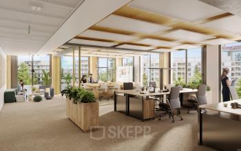 Modernes Büro zur Miete in der Obere Donaustraße 23-29, 1020 Wien. Arbeitsbereich mit großen Fenstern, Pflanzen und stilvollen Möbeln, einige Personen bei geschäftlichen Aktivitäten.