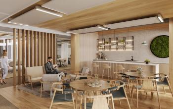 Modernes Büro in der Obere Donaustraße 23-29, 1020 Wien. Stilvolle, möblierte Lounge mit Personen, die geschäftlich interagieren. Ideal für diejenigen, die Bürofläche mieten möchten.