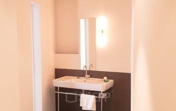 Modern and well-lit office space rental at Mittersteig 10, 1050 Vienna Margareten, featuring a sleek sink area with ample countertop space.