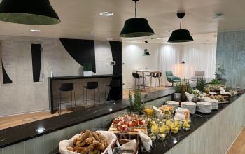 Modern office space rental at Am Euro Platz 2, 1120 Vienna Meidling, featuring a well-appointed pantry area with a buffet setup.