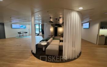 Modern office space rental at Am Euro Platz 2, 1120 Vienna Meidling with comfortable seating and stylish interior design.