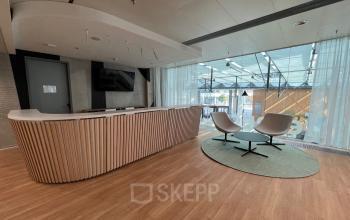 Modern reception area at office space rental in Am Euro Platz 2, 1120 Vienna Meidling with stylish seating and sleek design.