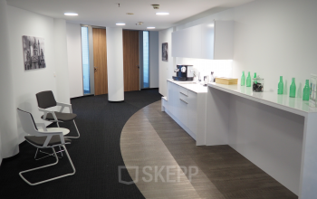 Stylish pantry area available for office space rental at Handelskai 94-96, 1200 Vienna Brigittenau, with modern amenities and seating.