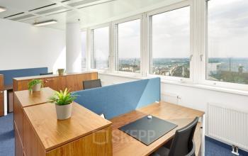 Bright, modern office space rental at Floridsdorfer Hauptstraße 1, 1210 Vienna, featuring individual workstations with windows providing ample natural light.