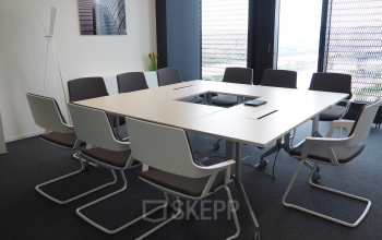 Elegantly furnished conference room available for office space rental at Donau-City-Straße 7, 1220 Vienna Donaustadt, with a modern meeting table and chairs.