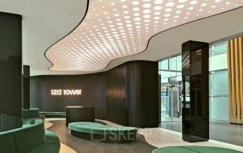 Elegant office space rental at Wagramer Straße 19, 1220 Vienna Donaustadt, featuring modern furnishings and unique lighting fixtures.