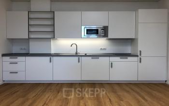 Modern kitchenette in an office space rental at IZ NÖ Süd Straße 3, 2351 Vienna (Neudorf), Vienna with sleek cabinets and appliances.