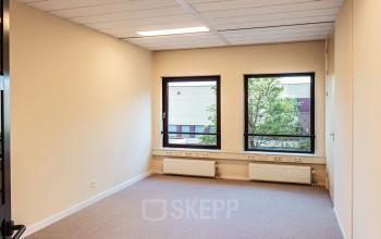 Unfurnished office space with large windows at Jool Hulstraat 2-14, Almere Stad, perfect for rent office space needs.