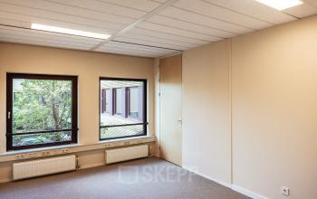 Bright office space with large windows and neutral walls at Jool Hulstraat 2-14, perfect for office space rental in Almere Stad.