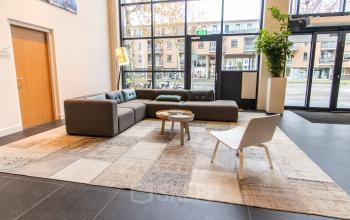 Spacious lounge area at Europalaan 16, Alphen aan den Rijn, featuring a cozy seating arrangement ideal for office space rental.