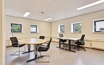 Bright office space at Astronaut 28, Amersfoort Calveen, featuring two workstations with ergonomic chairs and natural light. Ideal for office space rental, offering a comfortable and professional environment.