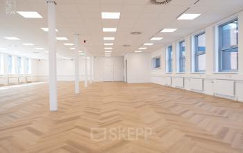 Spacious office for rent at Maanlander 43, Amersfoort Calveen with ample natural light and hardwood flooring, ideal for office space rental.