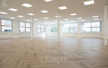 Bright office space with large windows, ample natural light, and elegant flooring at Maanlander 43 in Amersfoort Calveen, ideal for office space rental.