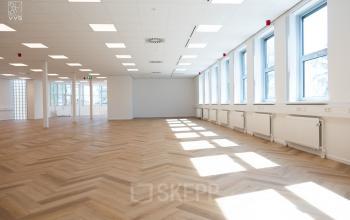 Bright office space with large windows and herringbone flooring located at Maanlander 43, Amersfoort Calveen, ideal for office space rental.