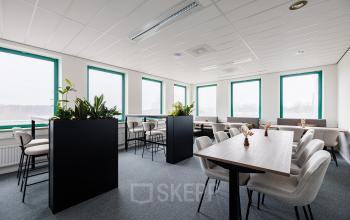 Spacious, well-lit office space at Stadsring 201, Amersfoort Centrum, available for rent with modern furniture and large windows.