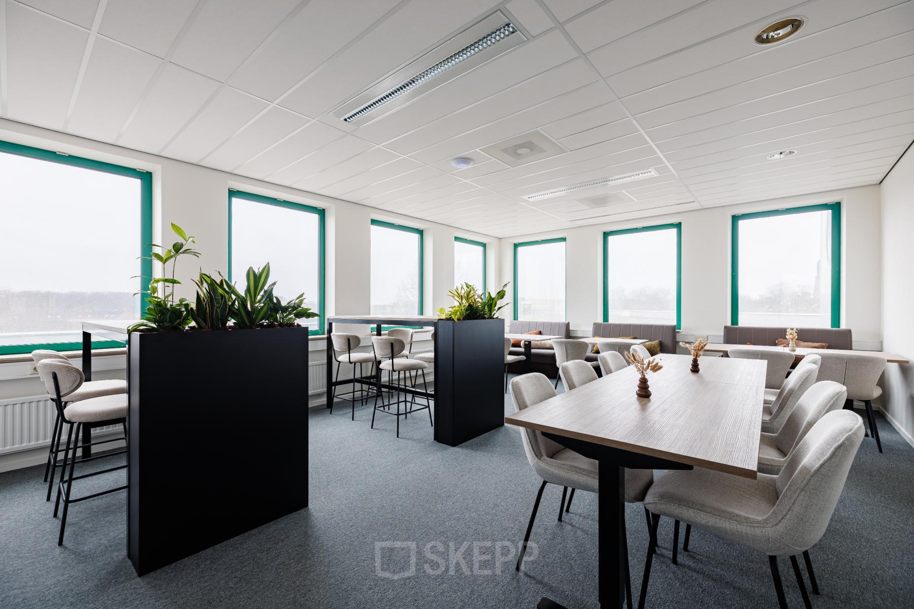 Spacious, well-lit office space at Stadsring 201, Amersfoort Centrum, available for rent with modern furniture and large windows.