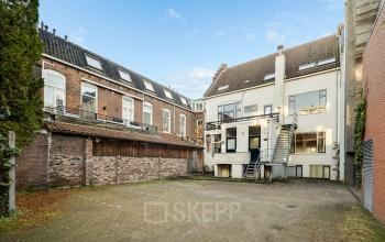 Exterior view of the office building at Stadsring 248-250, Amersfoort Centrum, showcasing a brick facade and multiple windows. Ideal for those looking to rent office space in a convenient location.