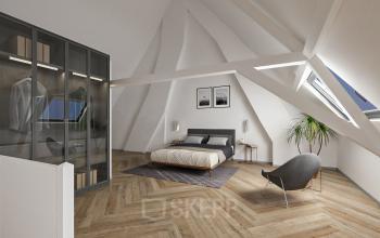 Bright office space rental at Stadsring 248-250, Amersfoort Centrum, featuring modern interiors with sloped ceilings and a cozy seating area.