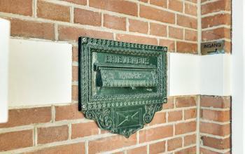 Close-up of a vintage mail slot at Stadsring 248-250, Amersfoort Centrum, highlighting the historic charm of the building exterior, ideal for office space rental.