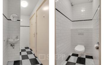 White-tiled bathroom with a sink, mirror, and toilet in an office space rental at Stadsring 248-250, Amersfoort Centrum.