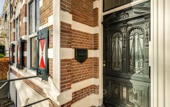 Quaint exterior of an office to rent at Stadsring 248-250 in Amersfoort Centrum, showcasing a classic brick facade and ornate doors.