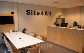 Furnished office space for rent at Algolweg 9-11, Amersfoort De Hoef, featuring a reception desk and seating area.