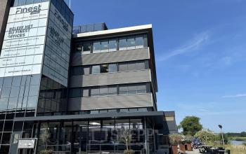 Exterior view of Vanadiumweg 11, Amersfoort Isselt, highlighting a modern multi-story office building available for office space rental.