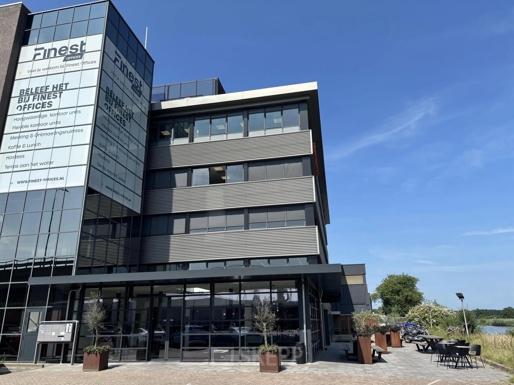 Exterior view of Vanadiumweg 11, Amersfoort Isselt, highlighting a modern multi-story office building available for office space rental.