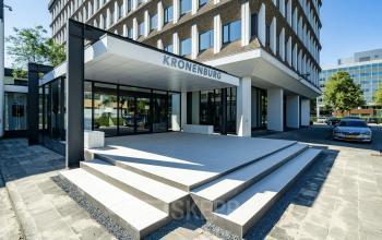 Exterior view of the modern office building at Professor E.M. Meijerslaan 1, Amstelveen, showcasing its sleek entrance and architectural design, a prime location for office space rental.