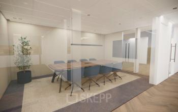 Modern conference room at Professor E.M. Meijerslaan 1, Amstelveen, featuring a sleek table and comfortable chairs, ideal for office space rental.