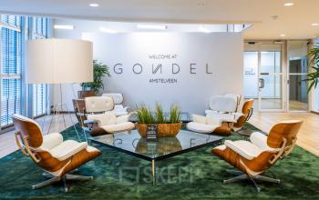 Modern, furnished lounge area at De Gondel 1, Amstelveen, ideal for office space rental with stylish seating and decor.
