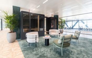 Stylish office space at Amsterdam Amstel Business Park, featuring modern furniture with comfortable seating areas ideal for meetings. Highlighting office to rent options with natural light and a welcoming atmosphere.