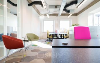 Bright office space at Willem Fenengastraat 2, Amsterdam Amstel Business Park, with colorful chairs and modern furnishings.