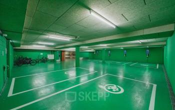 Green parking area with electric vehicle charging stations and bicycle storage at H.J.E. Wenckebachweg 90-108, Amsterdam Amstel Business Park, Amsterdam.