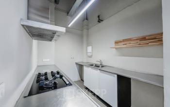 Pantry in office located at H.J.E. Wenckebachweg 90-108, Amsterdam Amstel Business Park, featuring a countertop with a stove, sink, and storage cabinets.