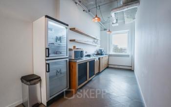 Modern pantry in office space at H.J.E. Wenckebachweg 90-108, Amsterdam Amstel Business Park, featuring kitchen appliances and shelving.