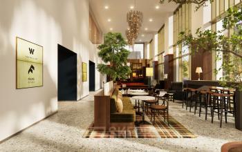 Spacious and stylish office interior at Willem Fenengastraat 16, Amsterdam Amstel, featuring modern seating and ample natural light available for office space rental.