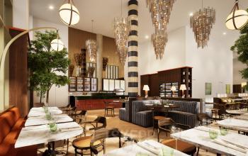 Spacious and modern interior at Willem Fenengastraat 16, Amsterdam Amstel, featuring elegant seating areas under striking chandeliers. Ideal for businesses looking for office space rental with style.