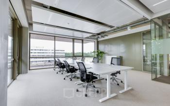 Bright office space with modern furnishings and large windows at Willem Fenengastraat 16, Amsterdam Amstel, ideal for office space rental.