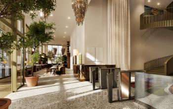 Bright and modern reception area with stylish furnishings and potted plants, located at Willem Fenengastraat 16, Amsterdam Amstel. Ideal for office space rental with plenty of natural light and elegant design.