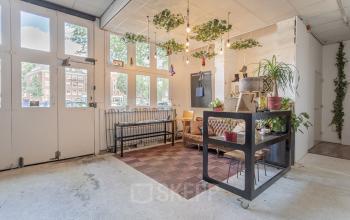 Chic and vibrant office space for rent at Oudeschans 21, Amsterdam Center, with unique decor and ample natural light.