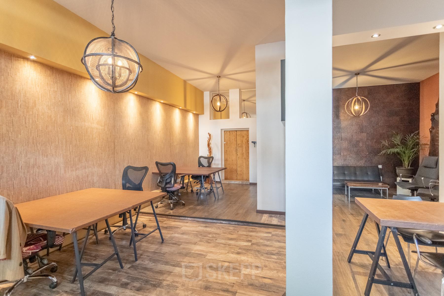 Contemporary office space rental at Oudeschans 21, Amsterdam Center, with stylish furnishings and ambient lighting.