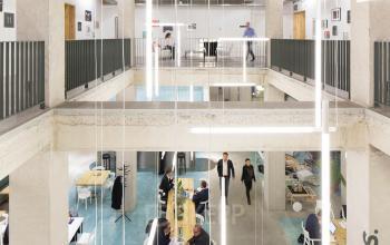 Modern office space rental at Vijzelstraat 68-78 in Amsterdam Center with professionals engaged in discussions and working on laptops.