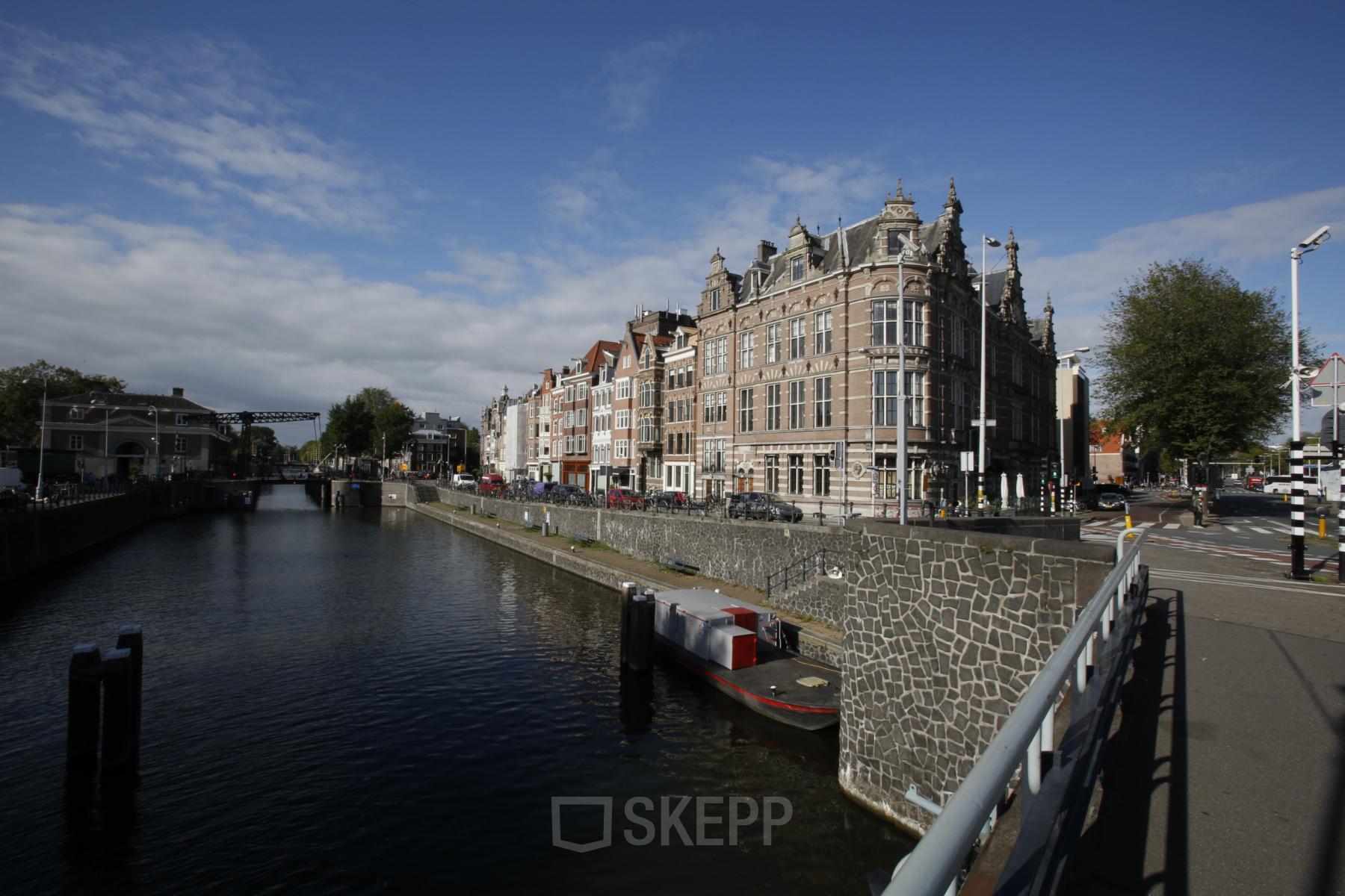 Exterior view of the historic office building at Schippersgracht 1-3, Amsterdam Center, featuring canal-side architecture ideal for office space rental.