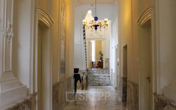 Elegant entrance hall at Singel 126 in Amsterdam Center, featuring marble floors and a classical design. Ideal for office space rental.