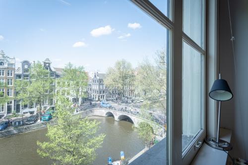 View from a window at Keizersgracht 241-2 office in Amsterdam Canal Belt, showcasing office space rental with scenic canal views.