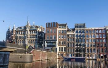 Exterior view of the office building at Prins Hendrikkade 48 A in Amsterdam Center, featuring classic canal-side architecture. Ideal location for businesses seeking office space rental in a vibrant city area.